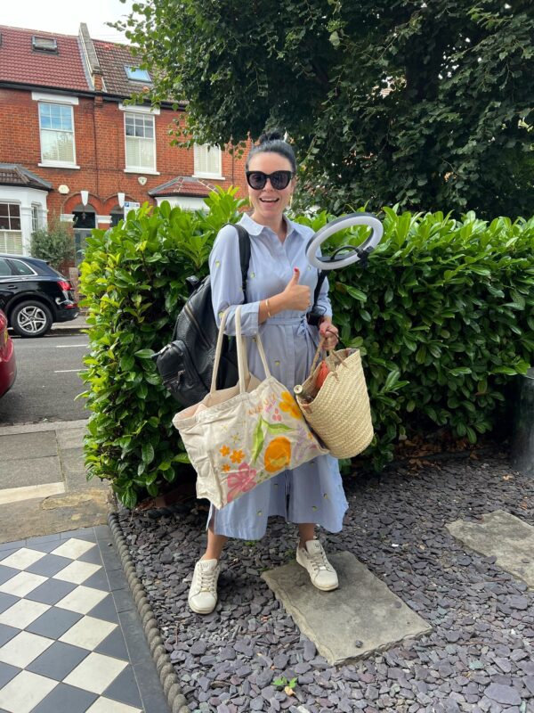 Leaving the house with my extendable ring light, phone holder, laptop, two chargers, three outfit changes and the wine that I am featuring