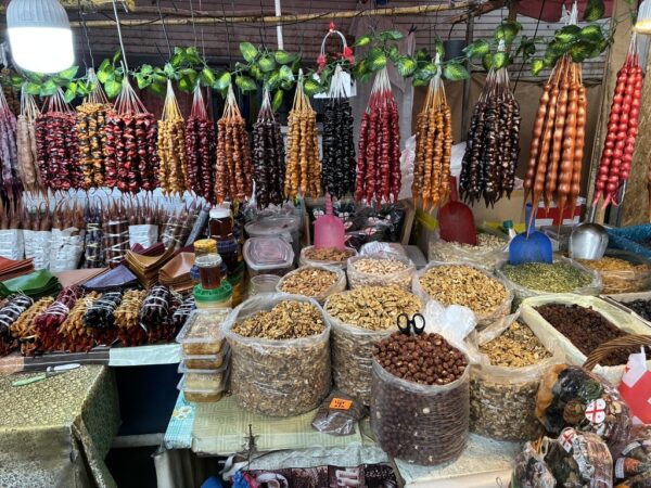 Strings of churchkhela – nuts covered in thickened fruit pulp – at a Tbilisi market stall