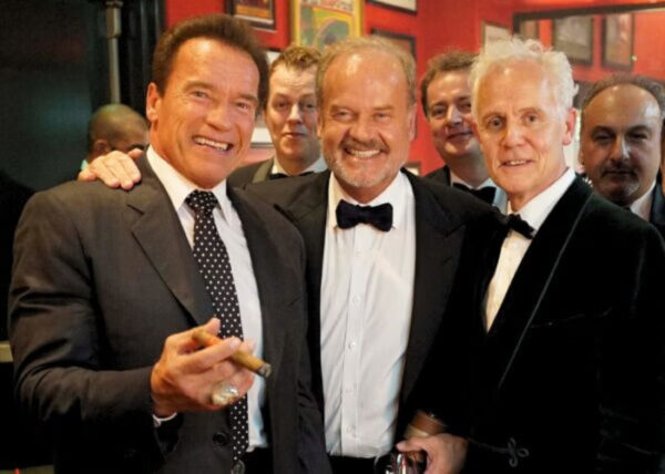 Arnold Schwarzeneger, Kelsey Grammer, and Paddy Renouf at the Boisdale Cigar Smoker of the Year Awards 2014. Background: Tom Parker Bowles, Bill Knott & Rocco Buonvino