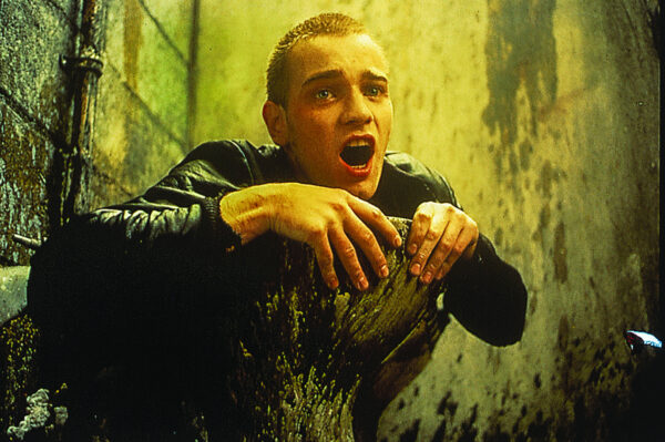 Ewan McGregor as addict Mark Renton in Trainspotting (1996), driving a porcelain bus