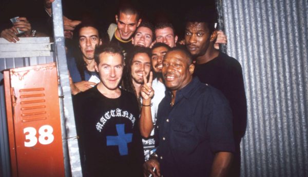 Horace (centre), Robert Del Naja (left) and Daddy G (far right) of Massive Attack surrounded by fans in Italy, 1999.