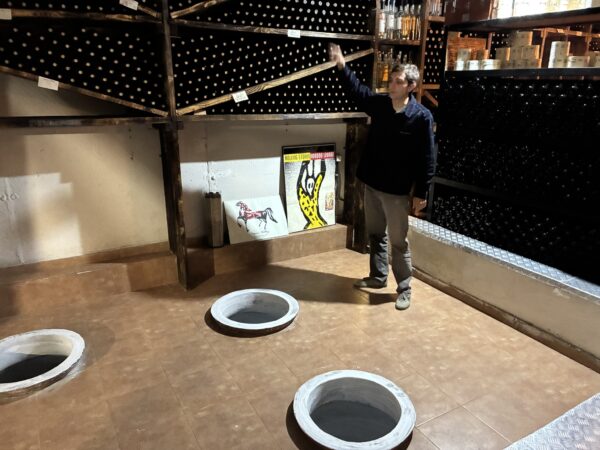 Sandro Kurdadze next to some of the kvevri in his family’s Papari Valley cellar.